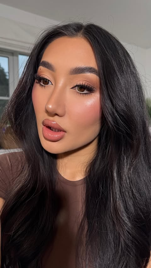 Instagram post by @xthuyle for Huda Beauty. Caption reads: This one is going straight in my makeup bag!....