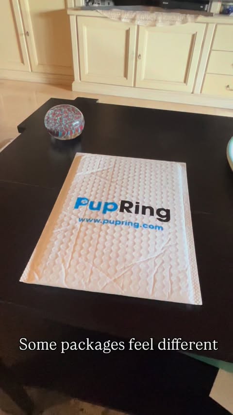 Instagram post by @brando_the_golden_retriever_ for Pupring. Caption reads: [...] close 🤍 This beautiful necklace by @pupring....