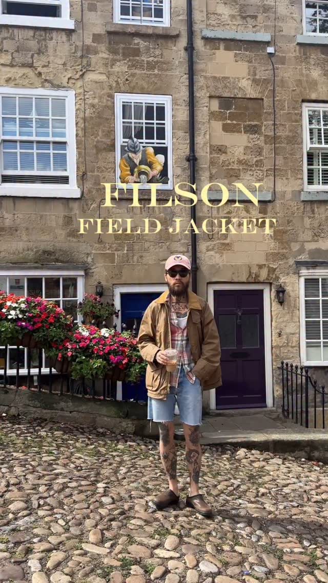 Instagram post by @barber_j.rose for Filson. Caption reads: [...] its unpredictable weather calls for this....