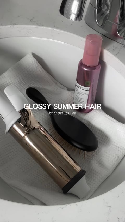 Instagram post by @lizaotovo for Kristin Ess Hair. Caption reads: [...] in summer humidity ✨ loving the new....