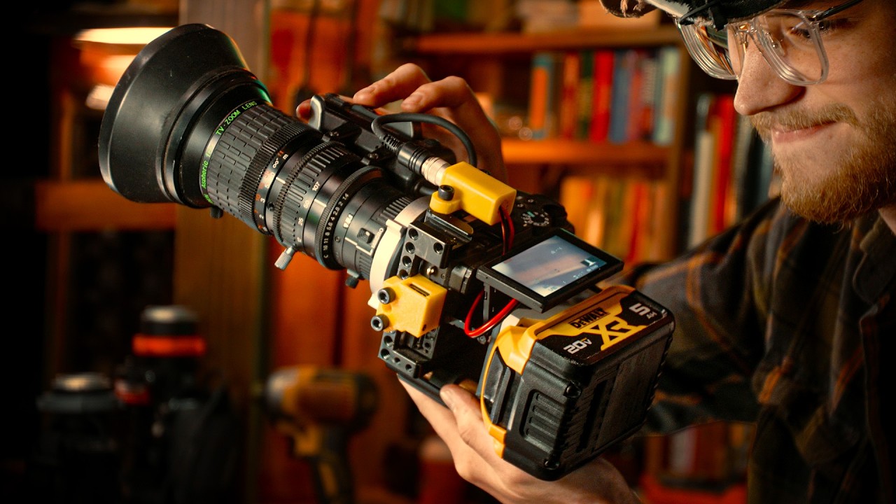 YouTube post by @EvanMonsma for PCBWay. Caption reads: [...] lens' zoom motors via drill batteries PCBWay....
