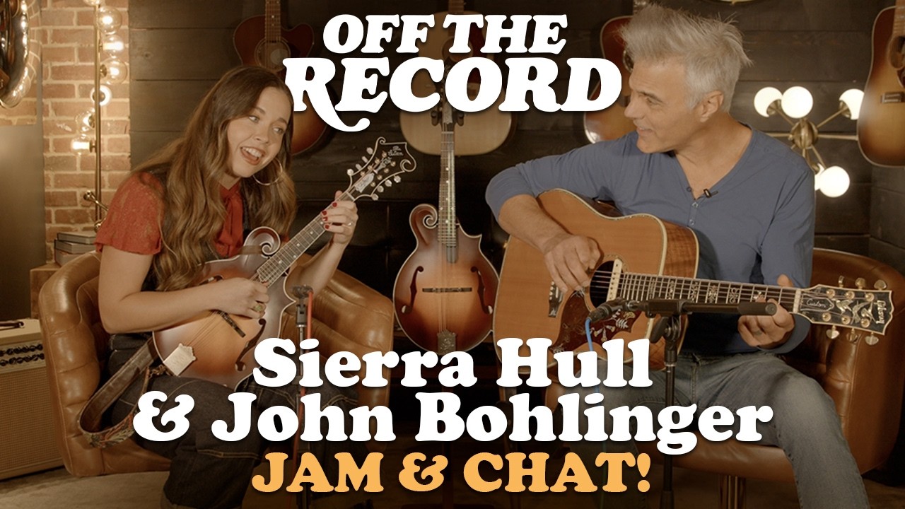 YouTube post by @premierguitar for Gibson. Caption reads: [...] pair of two fantastic F-style Gibson....