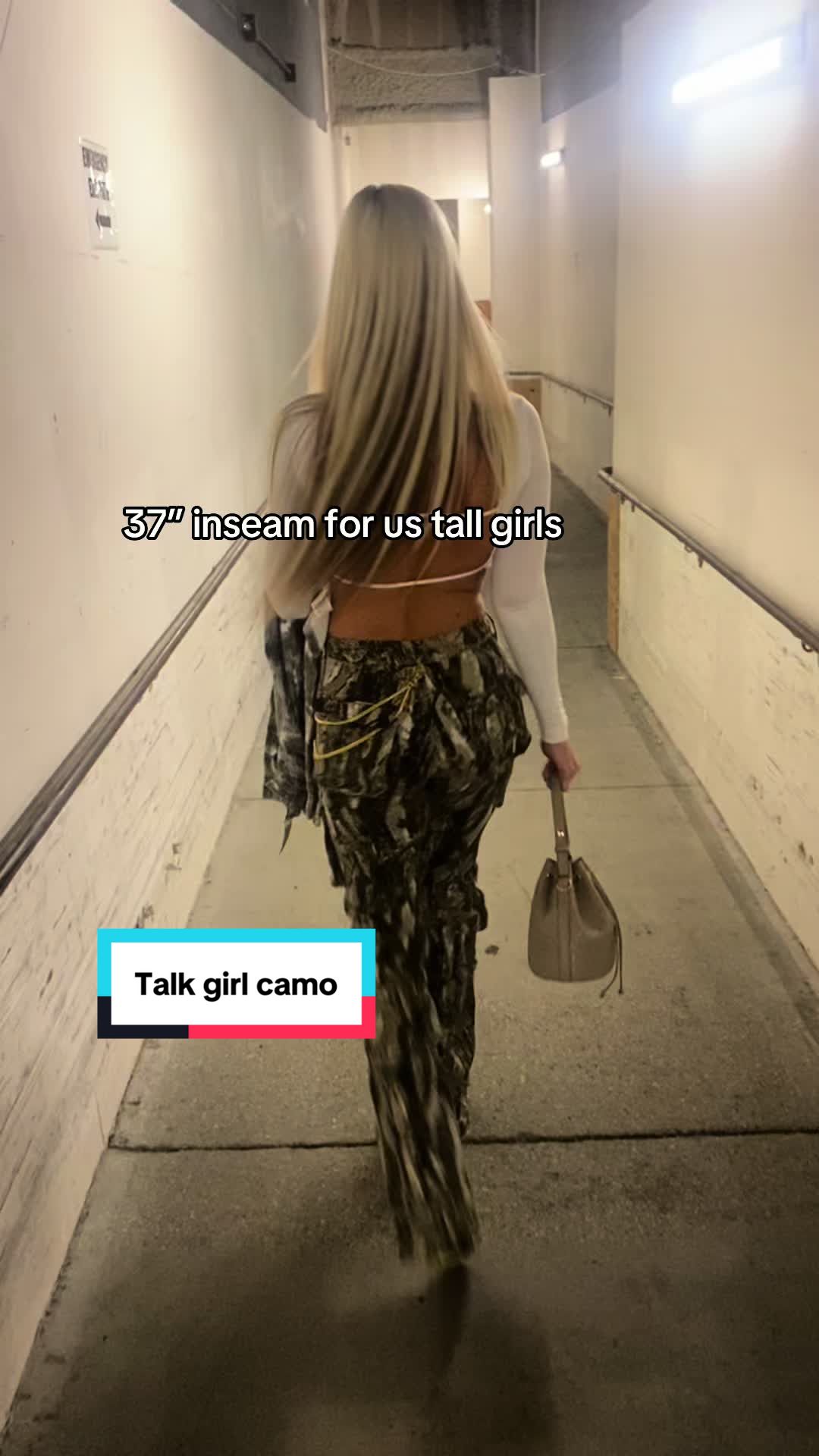 TikTok post by @mrsvaillancourt for Fashion Nova. Caption reads: These viral Fashion Nova tall girl camo pants are....