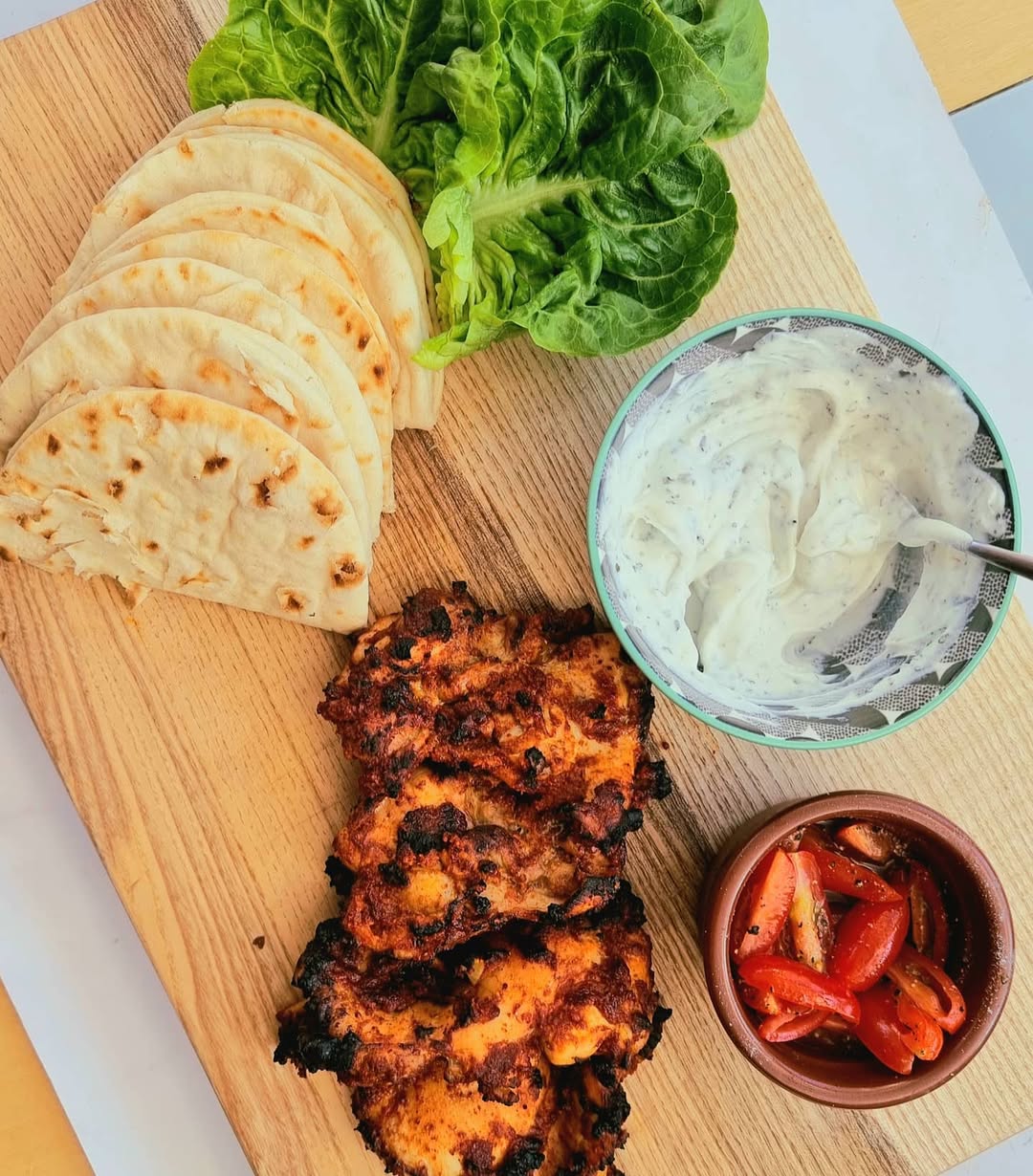 Instagram post by @bradley.foodie for Spicentice. Caption reads: 🥙🥙 CHICKEN THIGH KEBAB STYLE SHARING BOARD!....