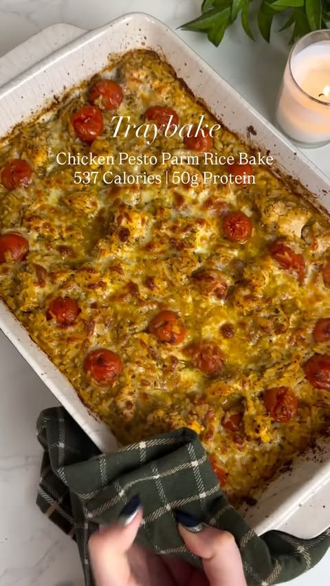 Instagram post by @slimming.gym.and.gin for MyFitnessPal. Caption reads: Recipe in caption ⬇️ Chicken Pesto Parm Rice Bake....