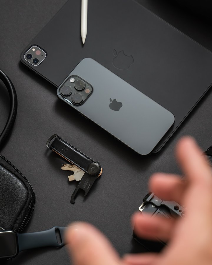 Instagram post by @tjpinkush for Orbitkey. Caption reads: POV you are a black gadget lover 🖤.