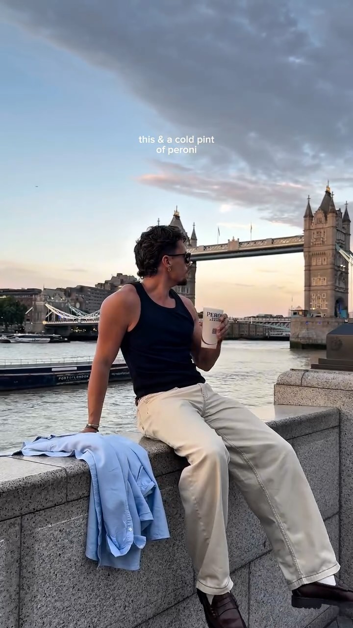 Instagram post by @samscottbills for Peroni Nastro Azzurro. Caption reads: AD | a cold peroni in summer by the river....