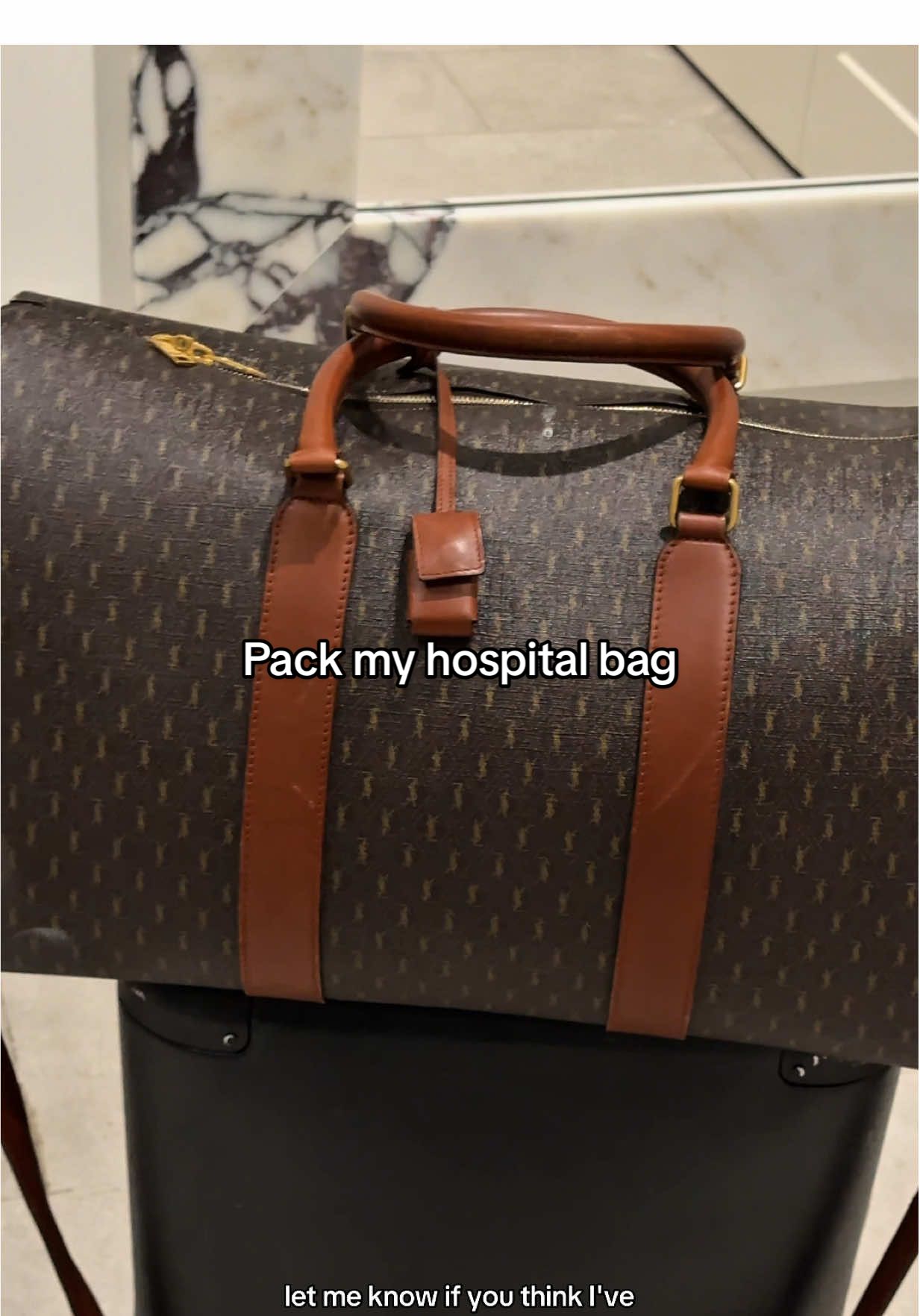 TikTok post by @katherinesdenton for July. Caption reads: This is everything I packed for me and the little....