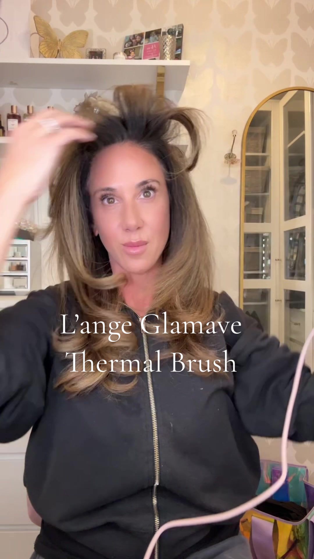 TikTok post by @daniella_britt for L’ange Hair. Caption reads: [...] A Topenga inspired blowout using the....