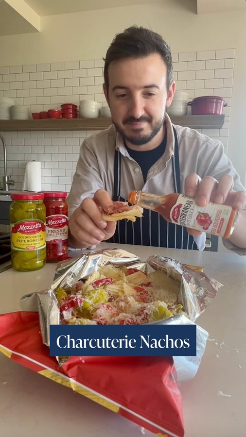 Instagram post by @thegoodcrispcompany for Mezzetta. Caption reads: We finally tried Charcuterie Nachos and they are....