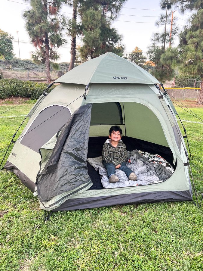 Instagram post by @hudson.brodyy for Delta Children. Caption reads: [...] up instant tent in olive green. 🏕️....