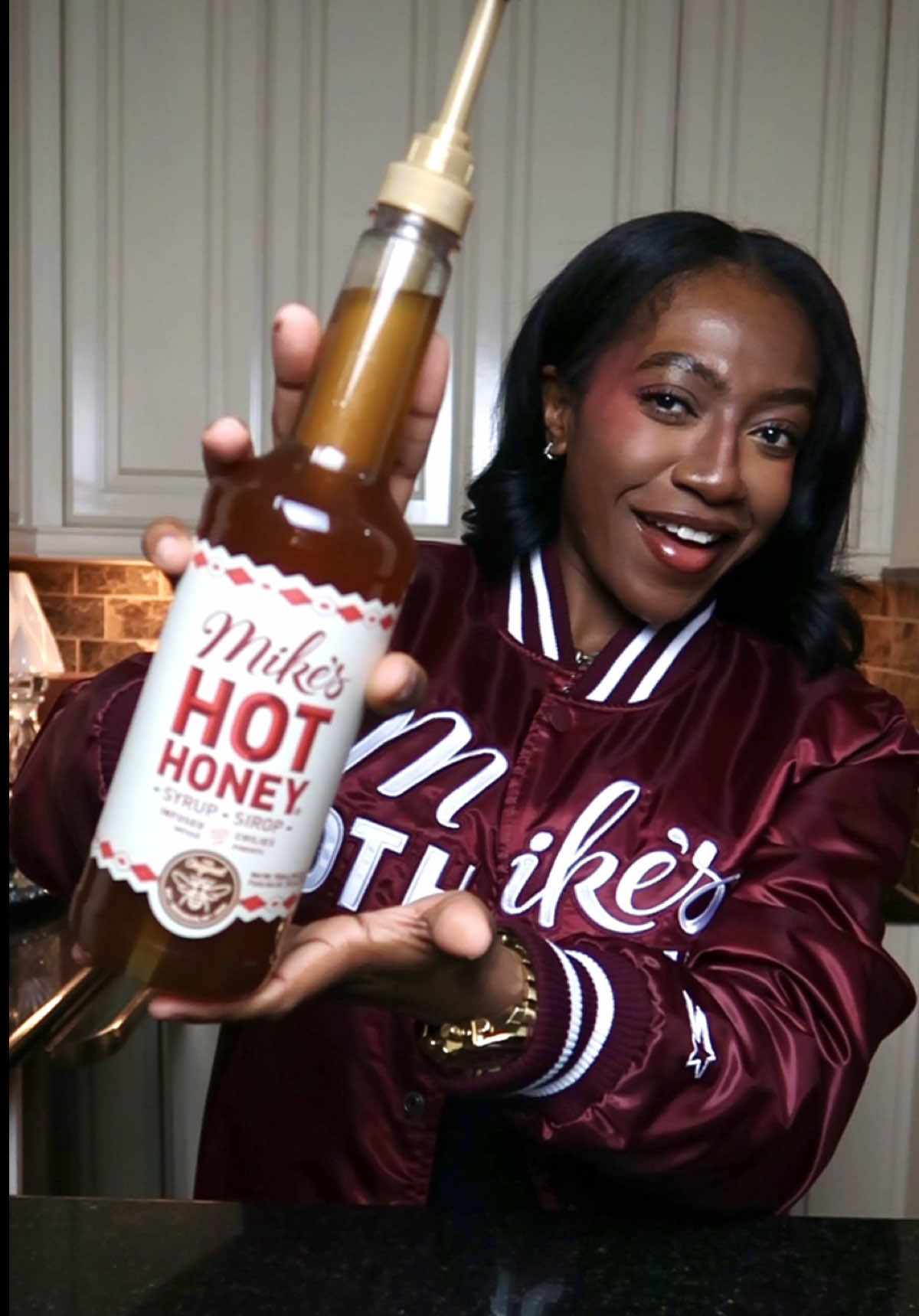 TikTok post by @thenotoriousvic for Mike's Hot Honey. Caption reads: HEATING UP THE HOLIDAYS AND BEYOND WITH THE....