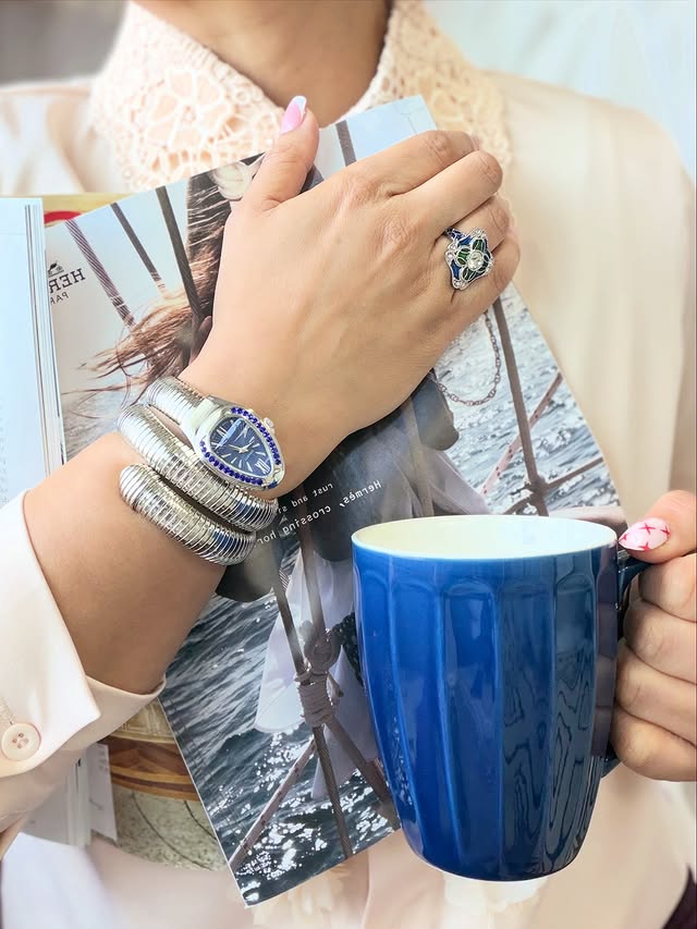 Instagram post by @scorpion_stylesuitcase for Shop LC. Caption reads: [...] Let them stare. 🔥 In frame 🖼️ 🐍⌚️-....