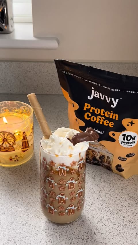 Instagram post by @_ugcbymi for Javvy Coffee. Caption reads: AD @javvycoffee make a protein iced coffee with me....