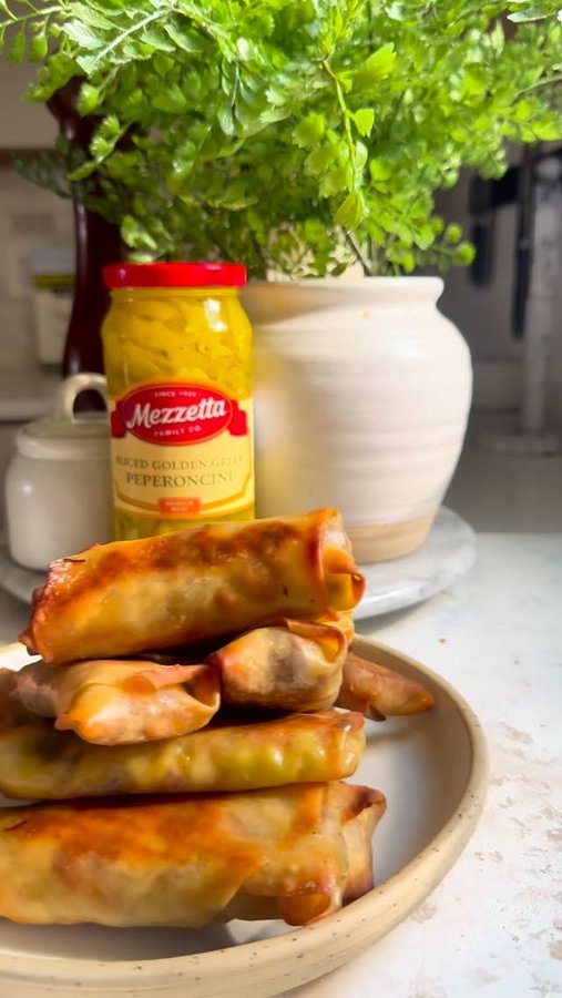 Instagram post by @britneybreaksbread for Mezzetta. Caption reads: Tell me why these Italian Beef Egg Rolls might....