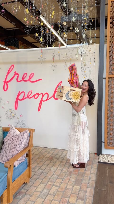 Instagram post by @destinydenizz for Free People. Caption reads: A dream day in my life.. painting at @freepeople....
