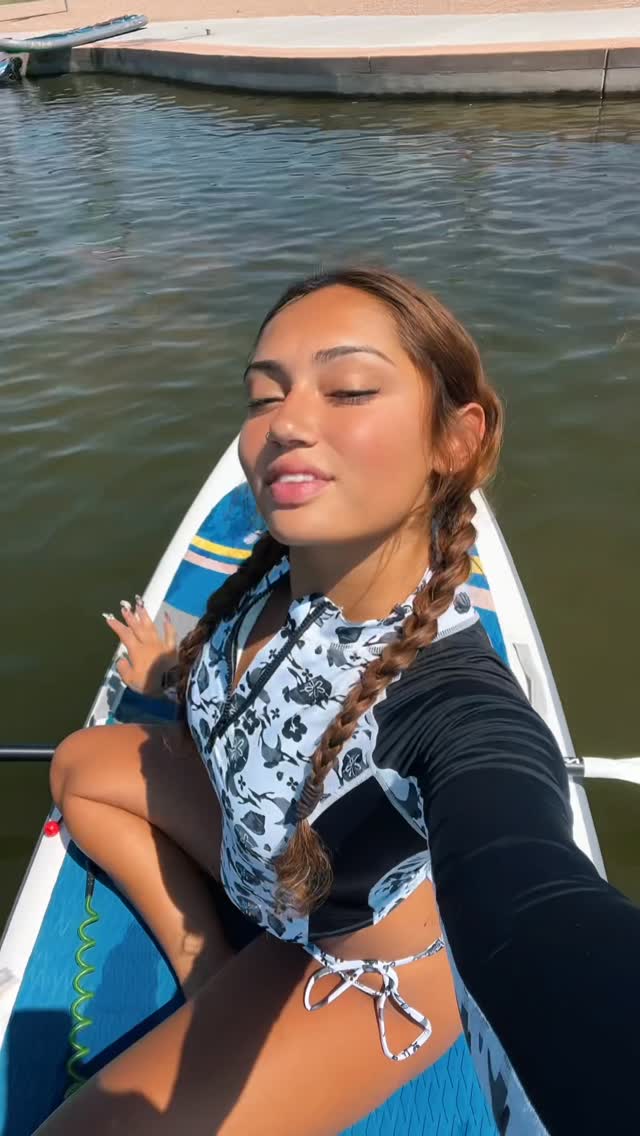 Instagram post by @avani for BLACKBOUGHSWIM. Caption reads: Paddle board yoga w an overheating phone 🚣‍♀️🤍.