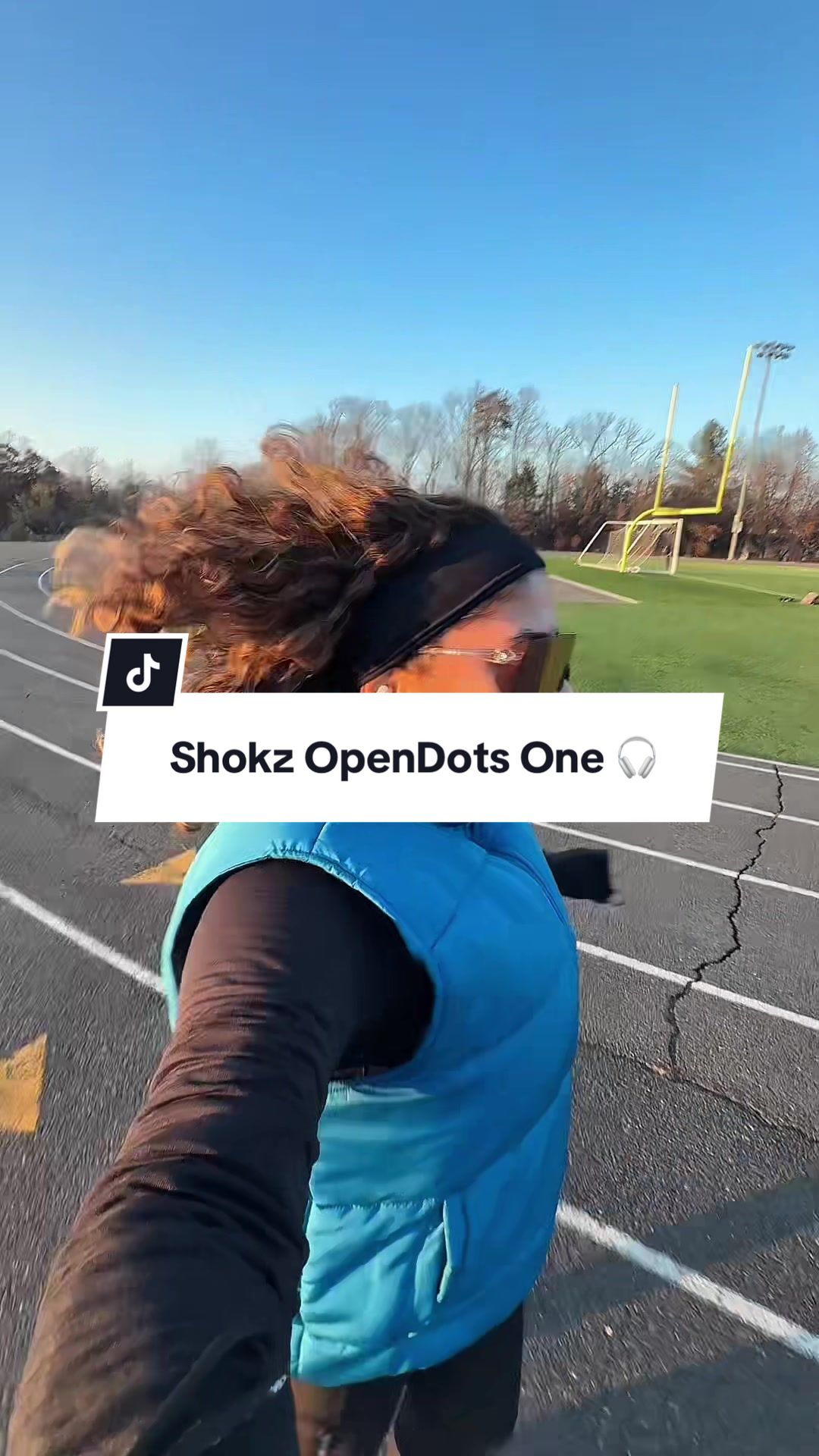 TikTok post by @amyygomes for Shokz. Caption reads: [...] Save 5% with code “AMYG5” ✨ @Shokz Sports....