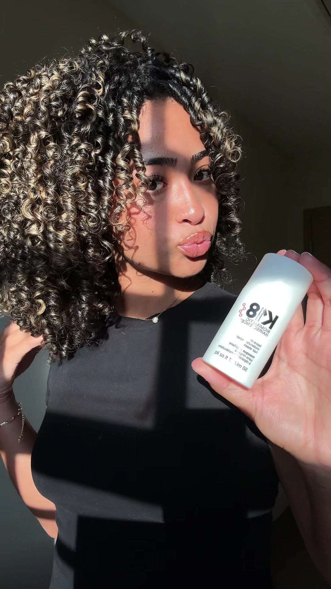 TikTok post by @isaa.javierr for K18 Hair. Caption reads: [...] to healthy curls in just FOUR mins 🤍 @K18....