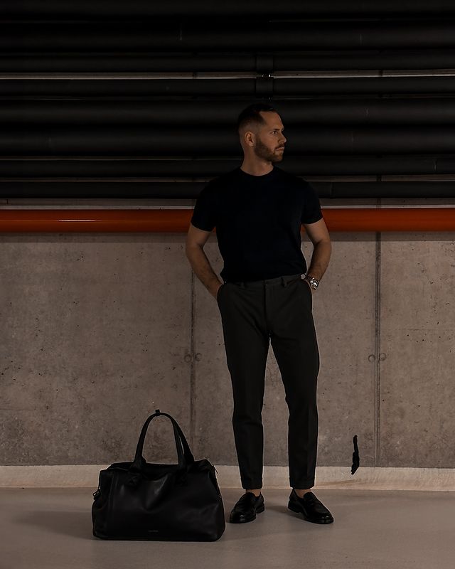 Instagram post by @adamsafranek for GINO ROSSI. Caption reads: Can’t go wrong with timeless black accessories....