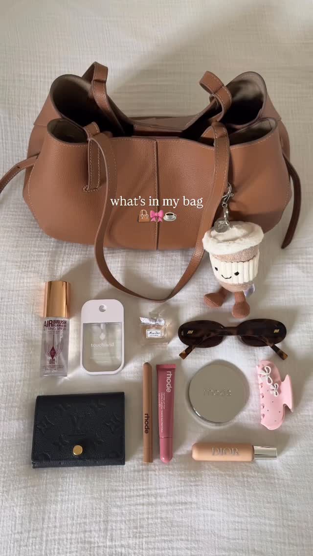 Instagram post by @carrieanne_ for Le Specs. Caption reads: what’s in my mini cyme 👜🎀☕️

@polene_paris....