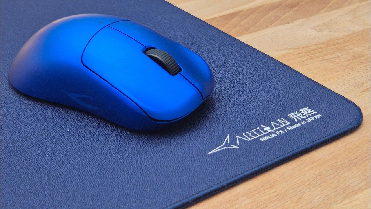 YouTube post by @jakeufps for WALLHACK. Caption reads: The Best Gaming Mouse Of 2025.