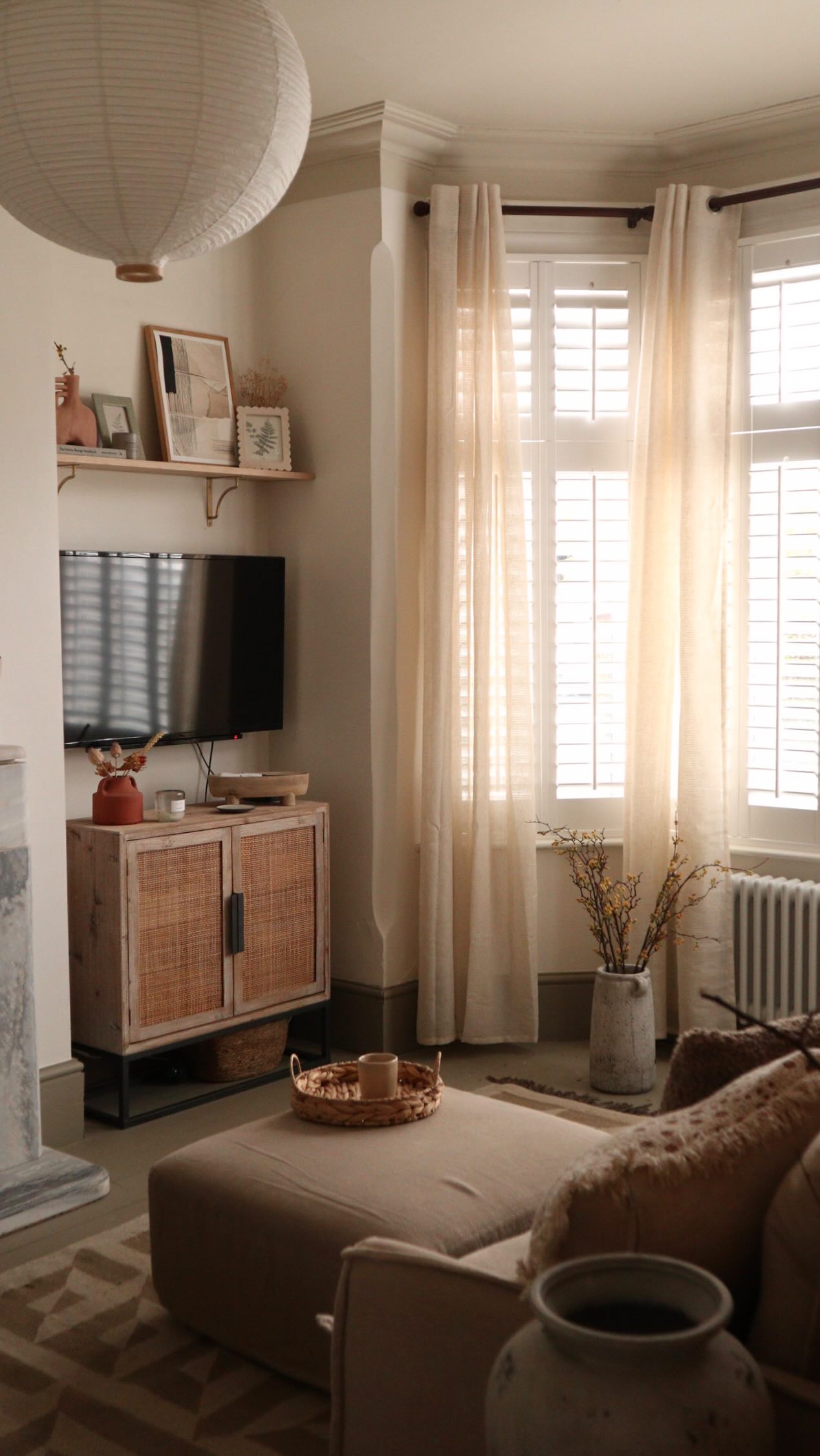 Instagram post by @ourneutralground for French Connection. Caption reads: Tbf, i say shut those curtains and get cosy at....