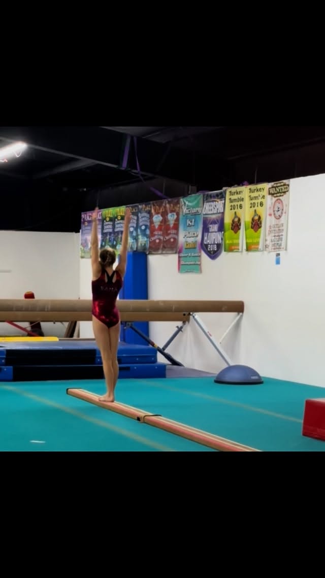 Instagram post by @gymnast_riley_simone for GK Elite. Caption reads: [...] today at practice. 🎉🎉

Alabama leo:....