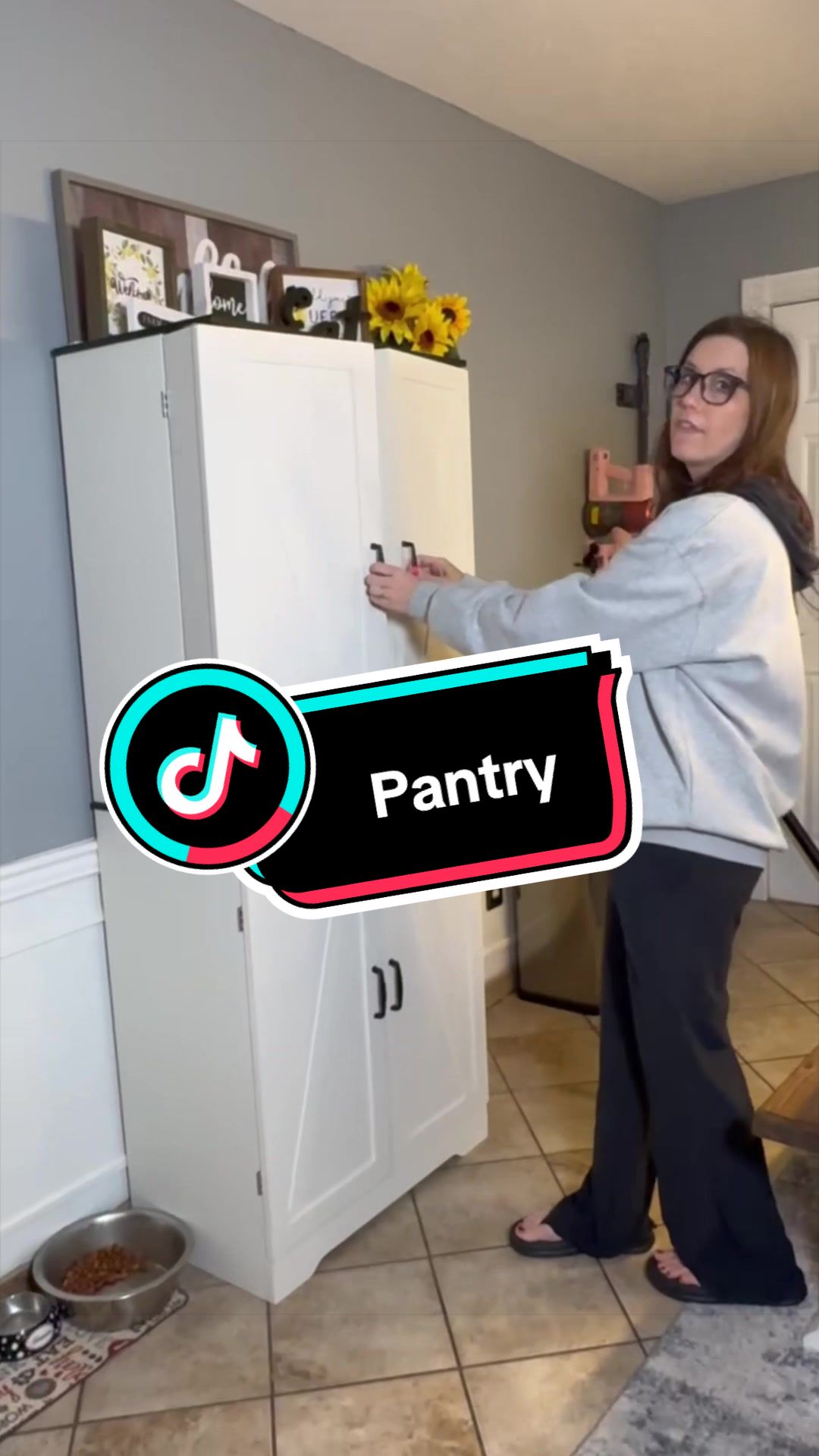 TikTok post by @steph_and_joey for Walsunny. Caption reads: @Walsunny Furniture White Floor Storage Cabinet....