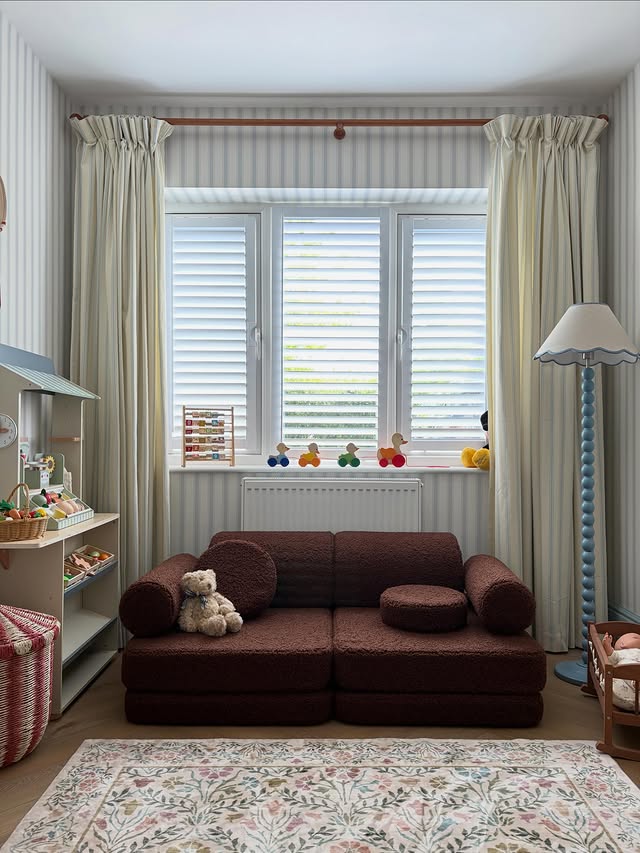 Instagram post by @at_home_in_the_hayward for Wigiwama. Caption reads: Ad| Our new @wigiwama play sofa in shade warm....
