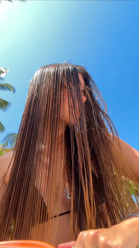 Instagram post by @juuliapuig for Olistic Science. Caption reads: feeding my hair with orange miracles 🫚🍊 carrot,....