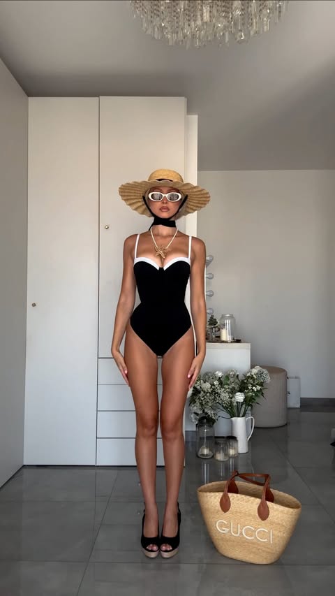 Instagram post by @sosazerafa for TA3. Caption reads: The viral @ta3 corset swimsuit 😳 Yay or Nay? Vote....