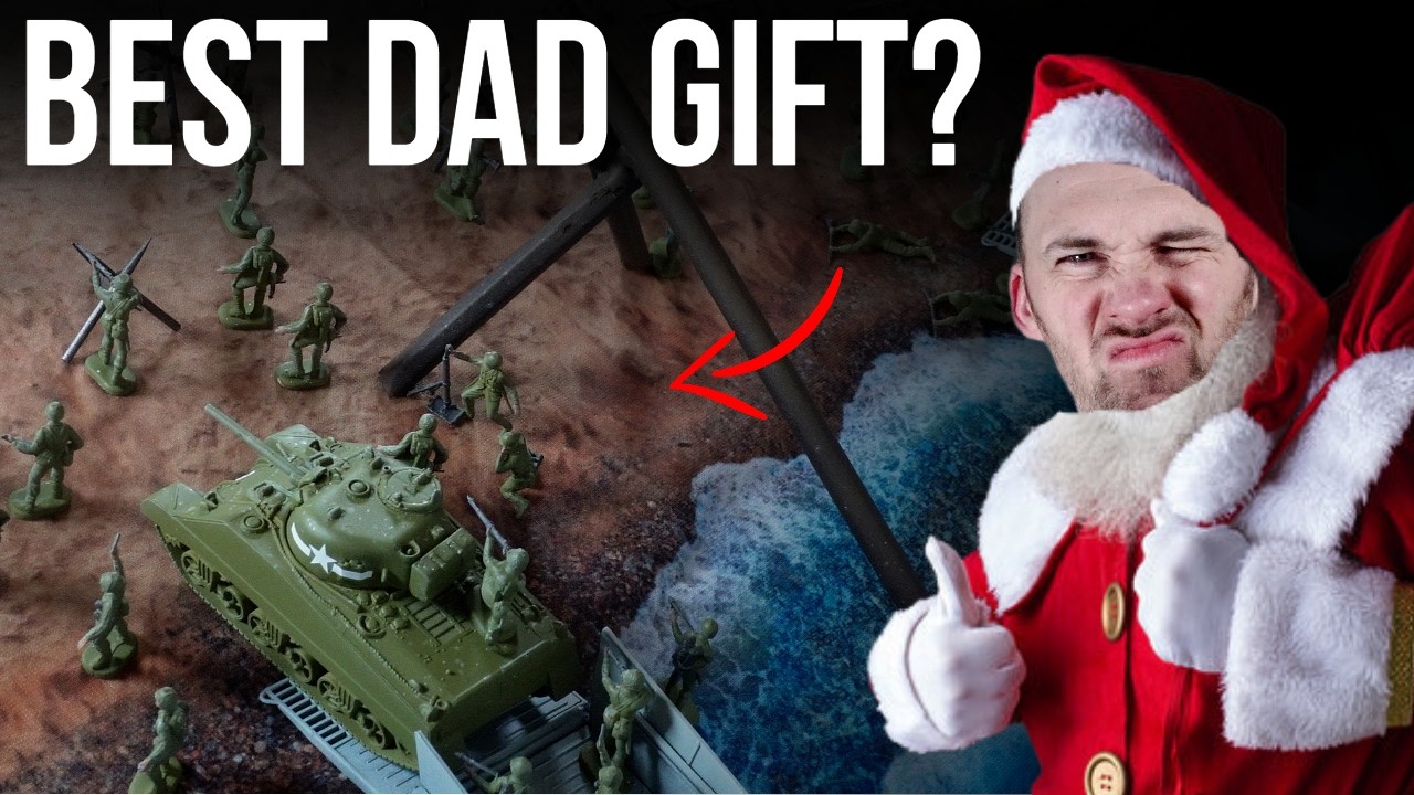 YouTube post by @PeachyTips for The Army Painter. Caption reads: Building D-Day Playset for Christmas - Best Dad....