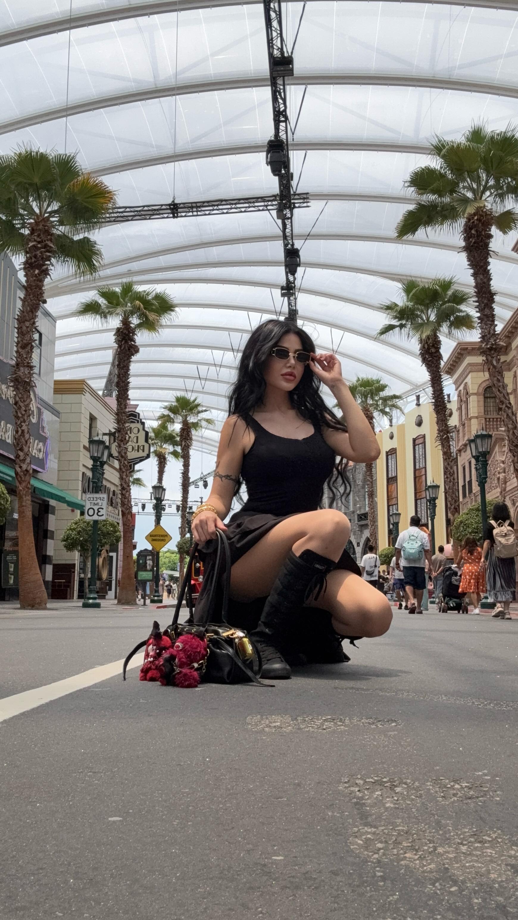 Instagram post by @mimogeorge for Universal Studios Hollywood. Caption reads: Universal Studios in Singapore + Airport Shopping....