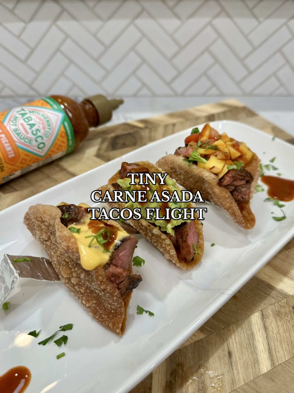 TikTok post by @thespicyjuju for TABASCO. Caption reads: [...] -  TINY CARNE ASADA TACOS FLIGHT (with....