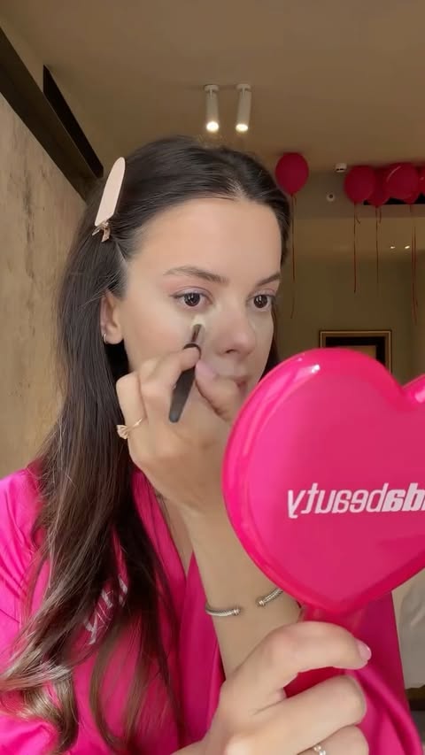 Instagram post by @melisketenci for HUDA BEAUTY. Caption reads: Powered by glam and a little bit of Huda Beauty....