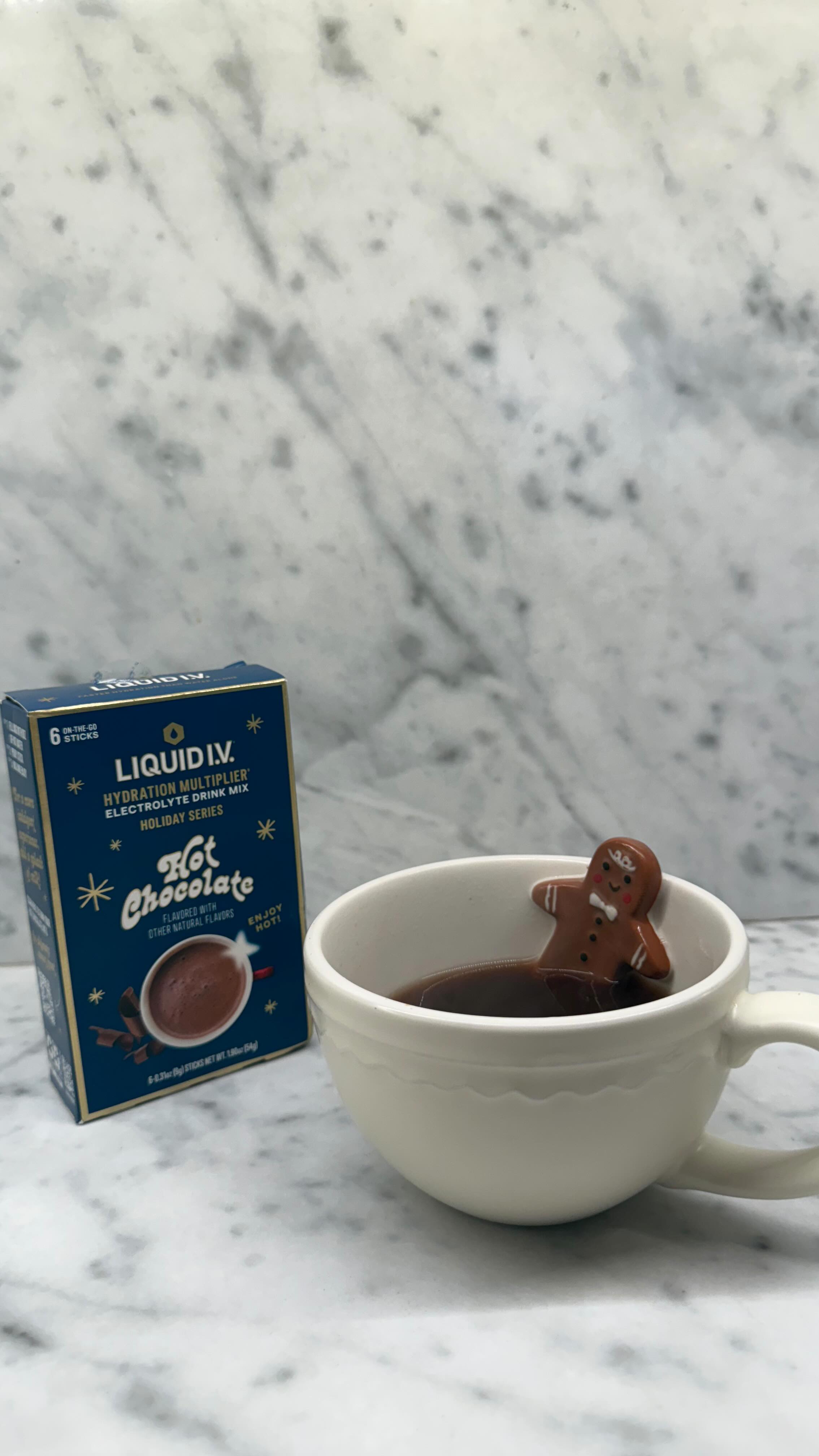 Instagram post by @chelseyamaro for Liquid IV. Caption reads: Sipping my way through the holiday chaos this....