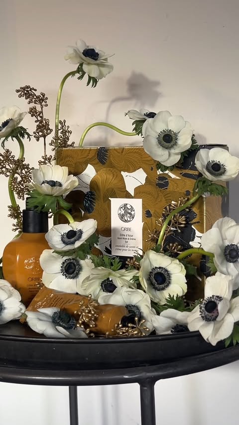 Instagram post by @puni.petals for Oribe. Caption reads: [...] and gold-dipped seeded eucalyptus. Inspired....