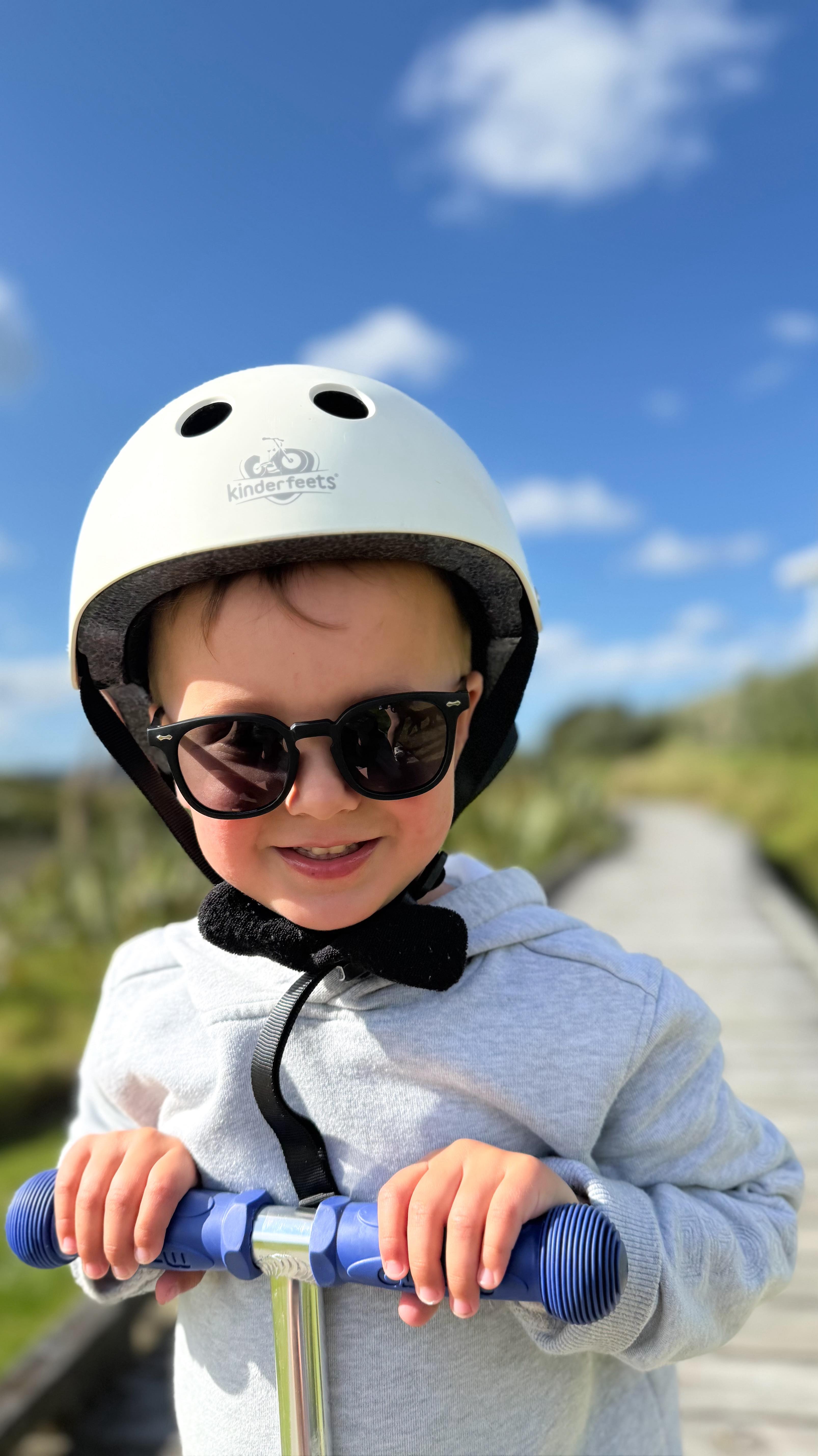 Instagram post by @itsnataliaross for Polarised Baby Sunglasses. Caption reads: Summer is already a vibe ☀️🕶️ Luca can’t get....