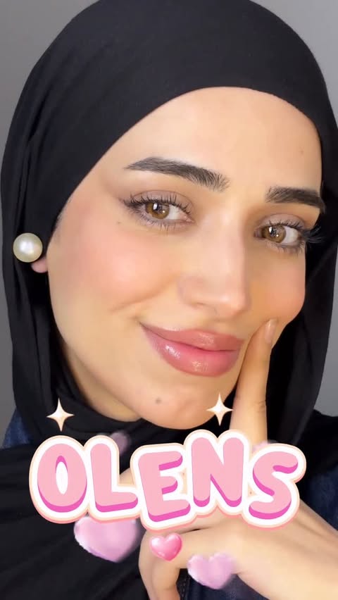 Instagram post by @xakispace for OLENS official (EN). Caption reads: Fake or real?👀💓 @olens_contactlens Spanish brown....