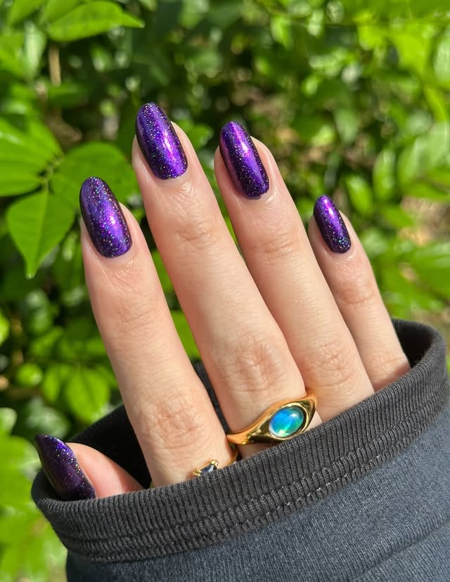 Instagram post by @natttynails for Caitlyn Minimalist. Caption reads: In a grand mood for purples 💜🫶🏻✨ highly....