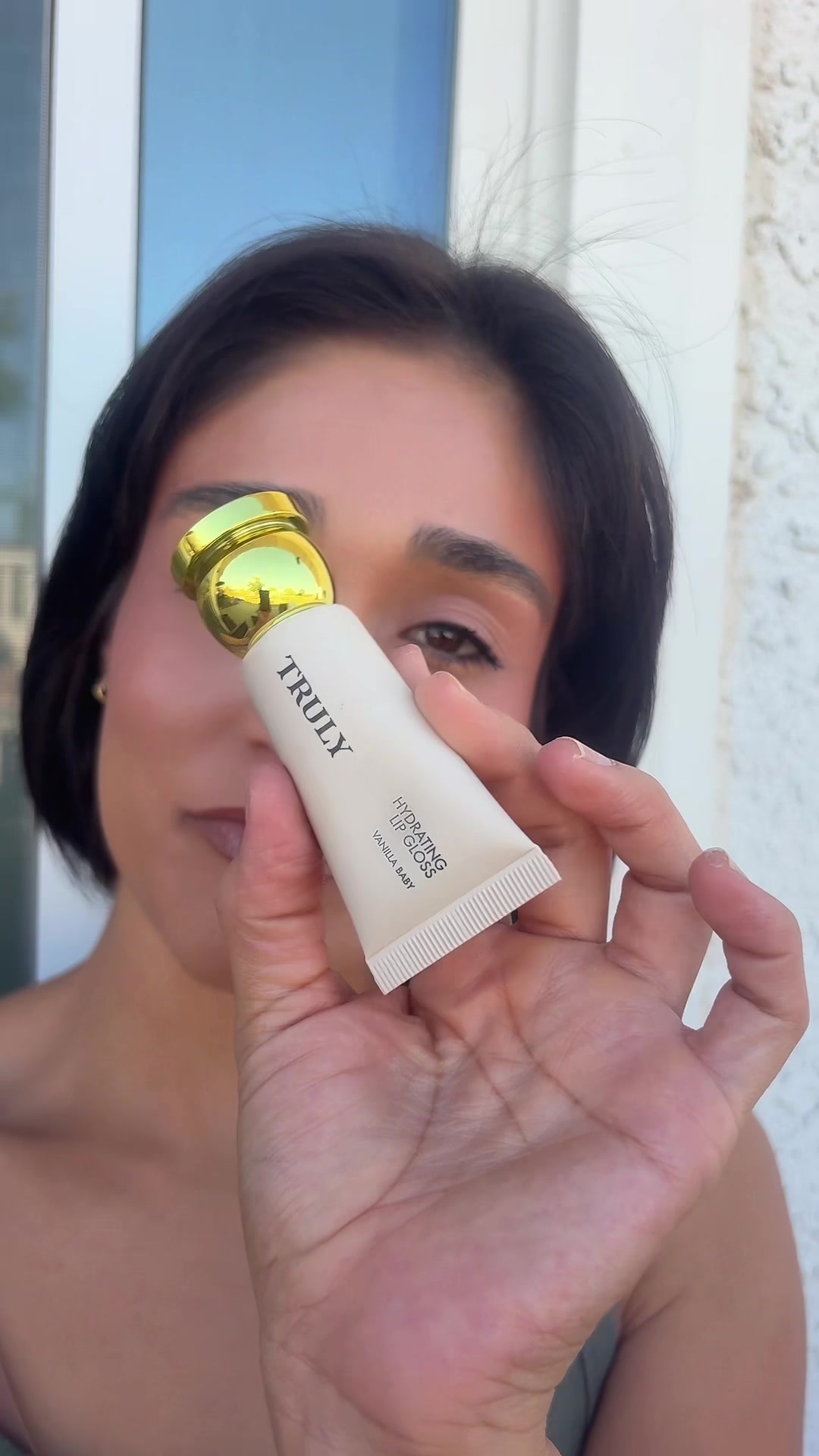 TikTok post by an influencer for Truly Beauty. Caption reads: @Truly Beauty #trulybeauty #lipgloss [...].