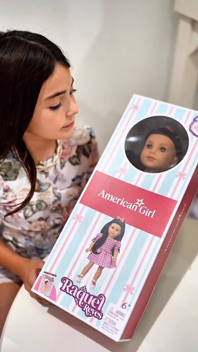 Instagram post by @karlamarquez_ for American Girl. Caption reads: ✨ Meet Raquel Reyes, American Girl’s 2026 Girl of....