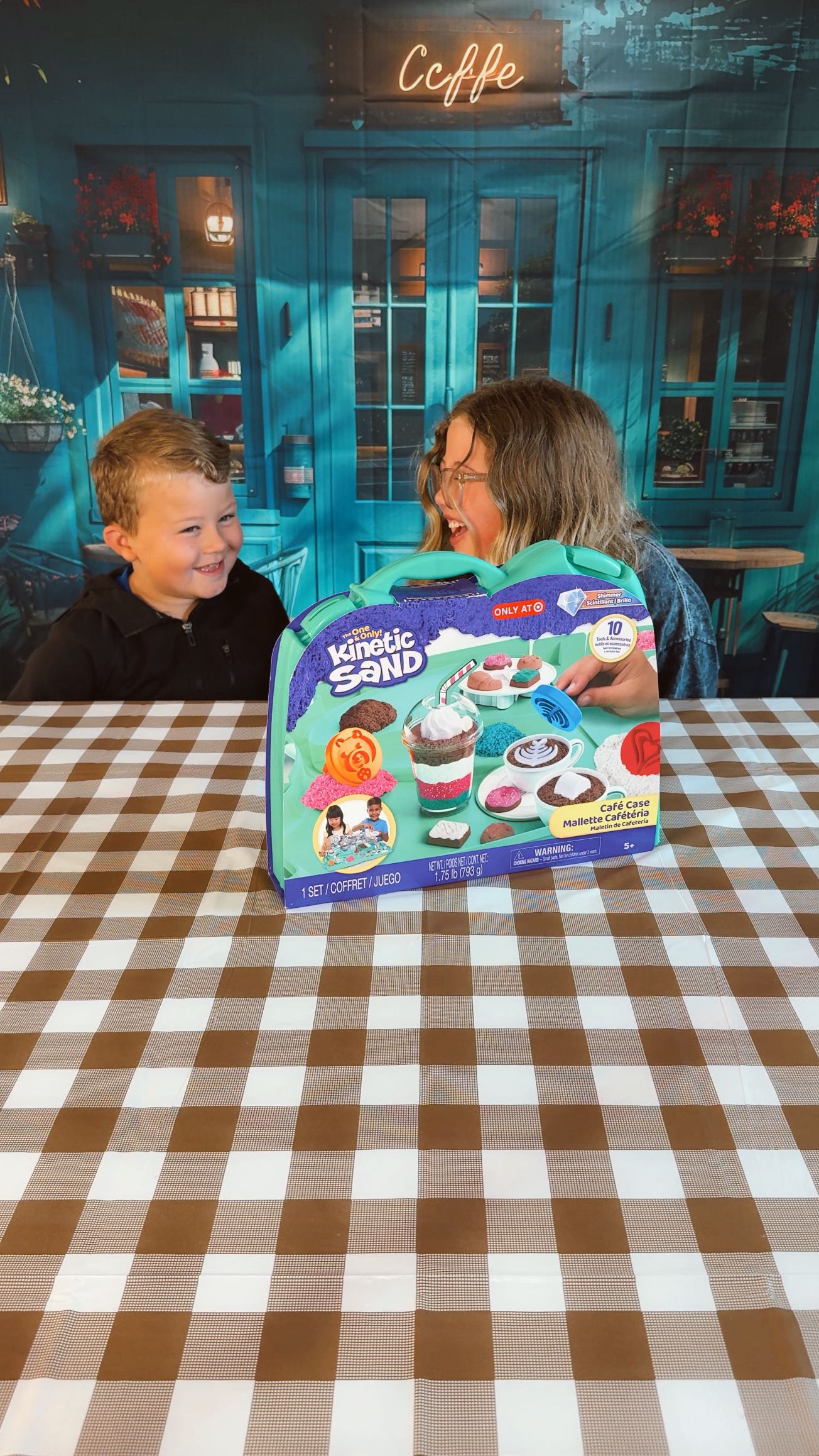 Instagram post by @mothering.on.margaritas for Kinetic Sand. Caption reads: Become a mini barista at home with the....