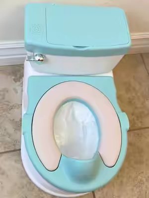 TikTok post by @emndadventures for Jool Baby. Caption reads: The @Jool Baby 2-1 Potty Training Toilet is such a....