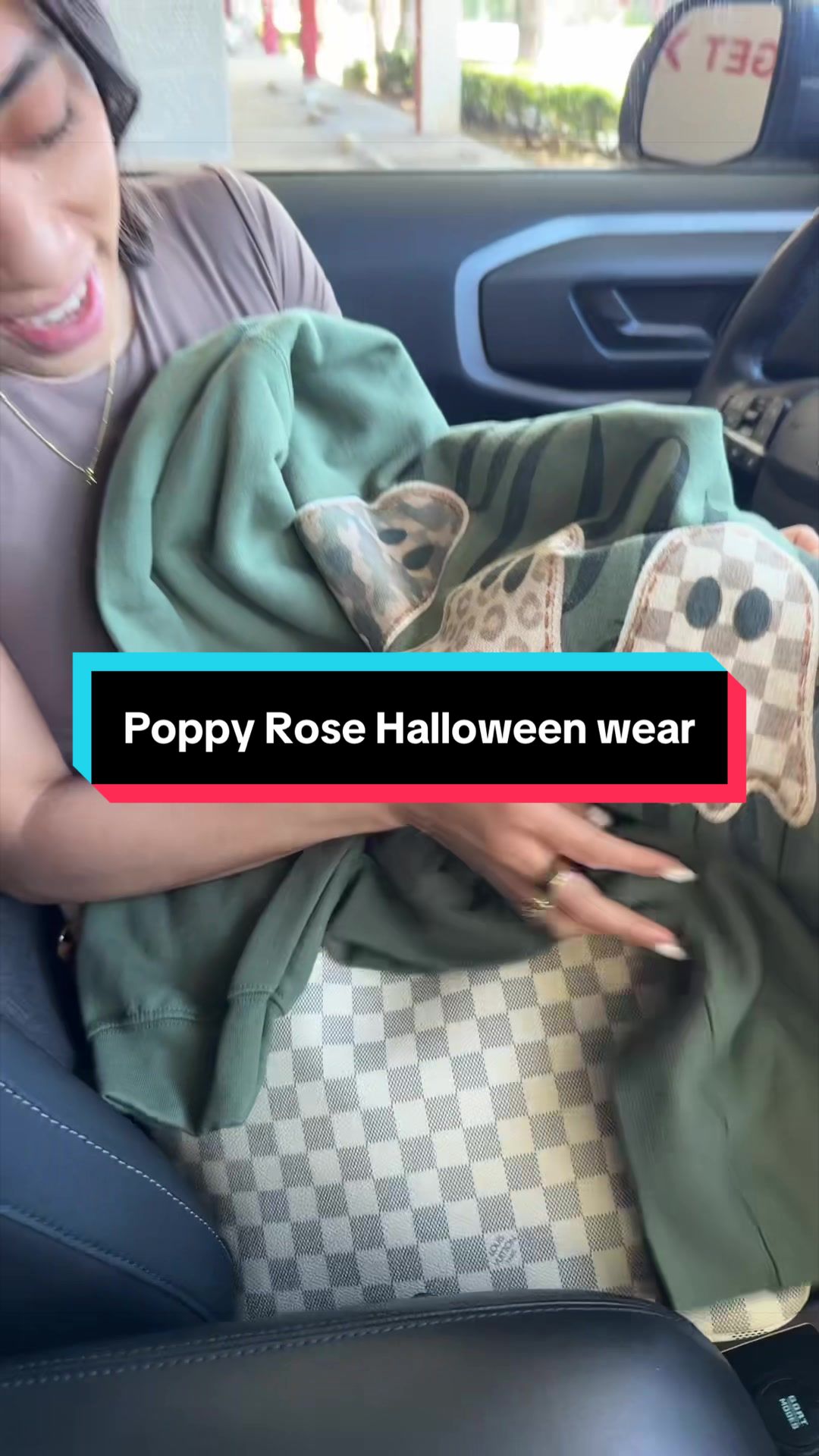 TikTok post by @christyyoo for PoppyRose Print Company. Caption reads: @PoppyRosePrintCompany #halloweensweater [...].