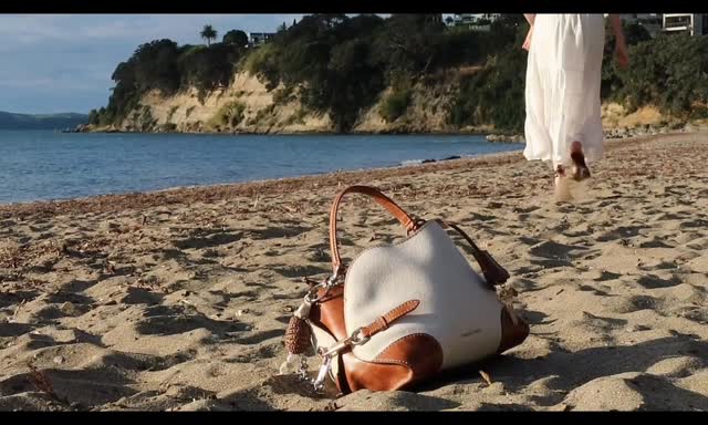 Instagram post by @sydniche for CHARLES & KEITH. Caption reads: [...] walks to afternoons by the sea.....