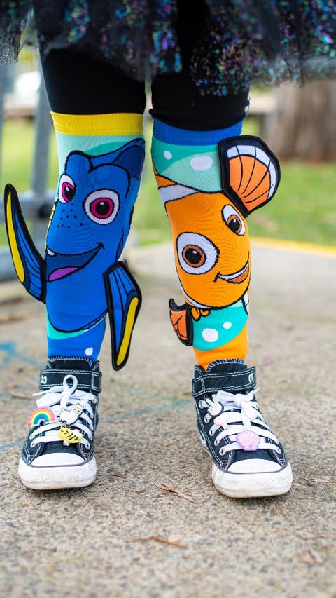 Instagram post by @lilwild_lilsweet_ for MADMIA. Caption reads: [...] into fun in the new Nemo and Dory socks....