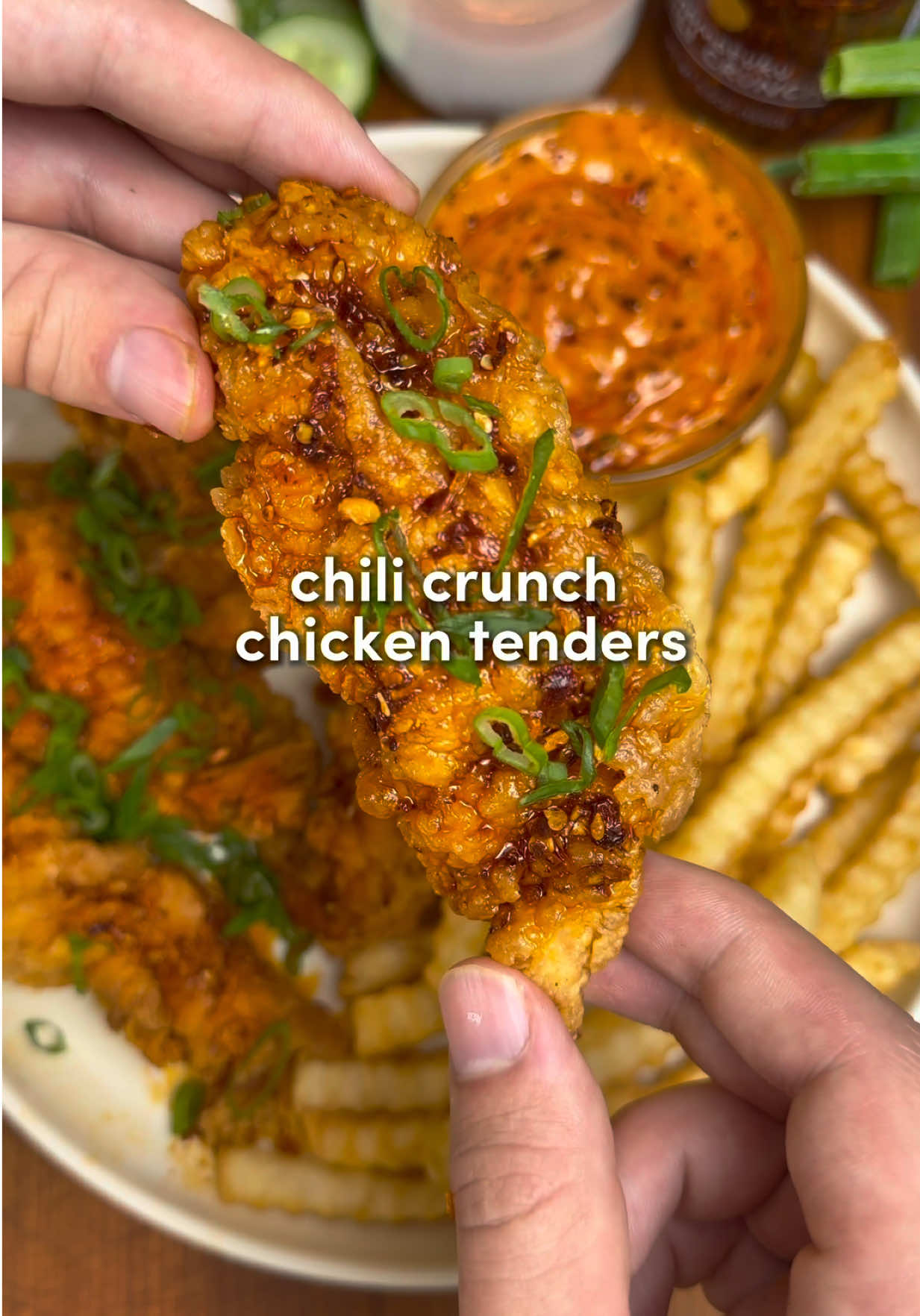 TikTok post by @recipeincaption for Momofuku. Caption reads: [...] juicy chicken tenders topped with Momofuku....