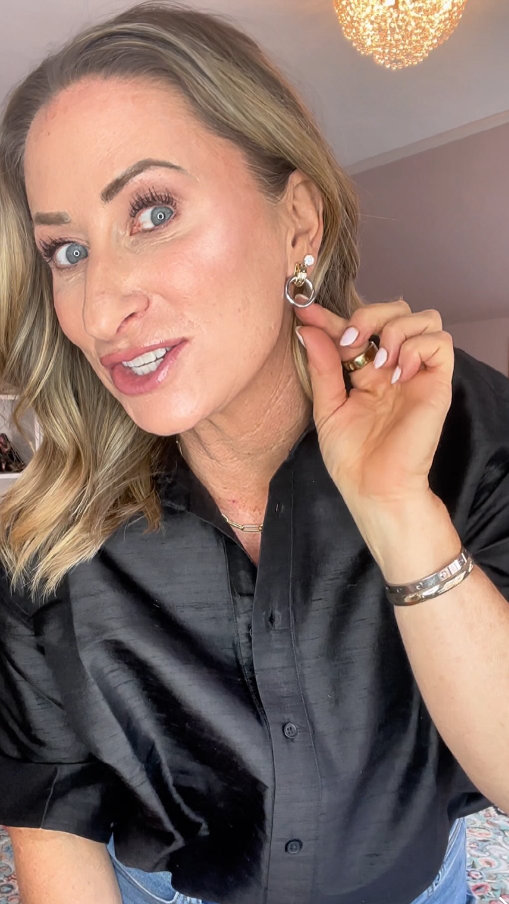 Instagram post by @lisalifeandstyle for ana luisa. Caption reads: Showing some close ups of the earrings i recently....